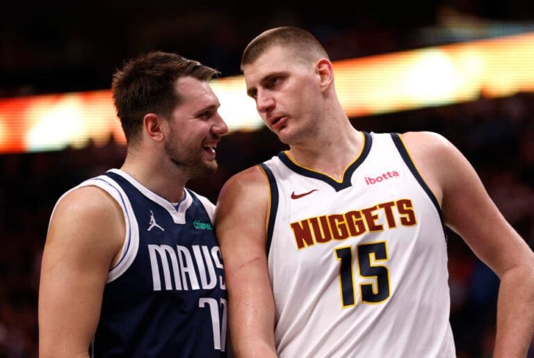 Luka Doncic #77 of the Dallas Mavericks and Nikola Jokic #15 of the Denver Nuggets