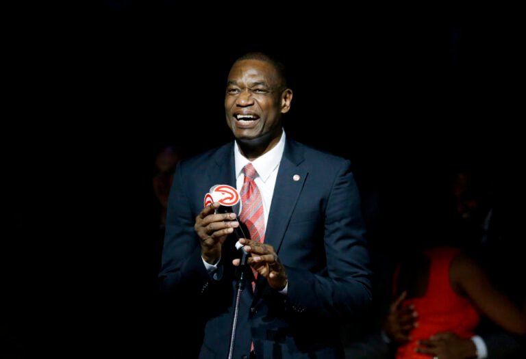 Former Atlanta Hawks' Dikembe Mutombo speaks during a halftime ceremony retiring his number at an NBA basketball game between the Hawks and the Boston Celtics on Tuesday, Nov. 24, 2015, in Atlanta. (AP Photo/David Goldman)