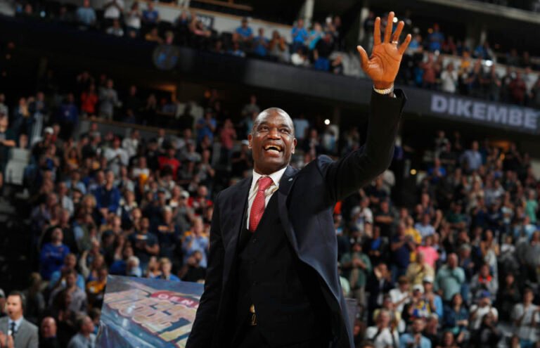 Retired Denver Nuggets center Dikembe Mutombo waves to the crowd as his jersey number is retired by the team during halftime of the Nuggets' NBA basketball game against the Portland Trail Blazers on Saturday, Oct. 29, 2016, in Denver. Portland won 115-113 in overtime. (AP Photo/David Zalubowski)