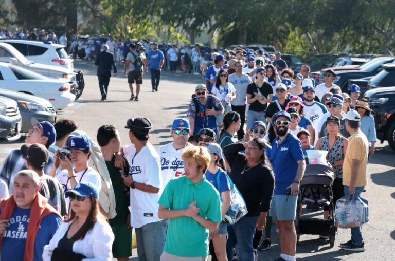 Los Angeles, Calif., Aug. 28, 2024-Fans arrive early to get there head of Dodgers player Shohei Ohtani before a game with the Orioles at Dodger Stadium on Wednesday. (Scally/Los Angeles Times)