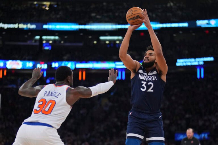 NEW YORK, NEW YORK - JANUARY 1: Karl-Anthony Towns #32 of the Minnesota Timberwolves shoots the ball against Julius Randle #30 of the New York Knicks at Madison Square Garden on January 1, 2024 in New York City. The Knicks beat the Timberwolves 112-106. NOTE TO USER: User expressly acknowledges and agrees that, by downloading and or using this photo, User agrees to the terms and conditions of the Getty Images License Agreement. (Photo by Mitchell Leff/Getty Images)