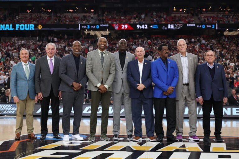 GLENDALE, ARIZONA - APRIL 06: (LR) John Doleva, Jerry Colangelo, Chauncey Billups, Vince Carter, Michael Cooper, Bo Ryan, Charles Smith, Doug Collins and Herb Simon pose for photos during a ceremony honoring the Naismith Basketball Hall Of Fame Class. From 2024 at halftime of the NCAA Men's Basketball Tournament Final Four semifinal game between the North Carolina State Wolfpack and the Purdue Boilermakers at State Farm Stadium on April 06, 2024 in Glendale, Arizona. (Photo by Christian Petersen/Getty Images)