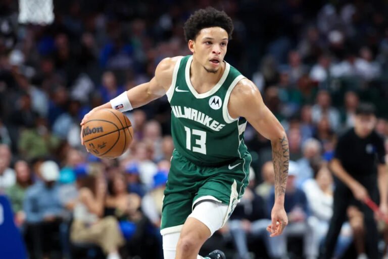 October 17, 2024; Dallas, Texas, USA; Milwaukee Bucks guard Ryan Rollins (13) dribbles during the second half against the Dallas Mavericks at American Airlines Center. Mandatory Credit: Kevin Jairaj-Imagn Images