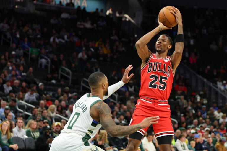 MILWAUKEE, WISCONSIN - OCTOBER 14: Jalen Smith #25 of the Chicago Bulls shoots over Damian Lillard #0 of the Milwaukee Bucks during the first half of a preseason game at Fiserv Forum on October 14, 2024 in Milwaukee, Wisconsin. NOTE TO USER: User expressly acknowledges and agrees that, by downloading and or using this photo, User agrees to the terms and conditions of the Getty Images License Agreement. (Photo by Stacy Revere/Getty Images)