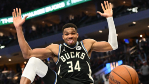 Giannis Antetokounmpo celebrates after scoring a slam dunk for the Milwaukee Bucks against the Indiana Pacers