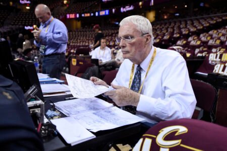 ABC television basketball analyst Hubie Brown goes over a stat while sitting at the scoreboard before Game 3 of the NBA Finals at Quicken Loans Arena in Cleveland, Ohio, on Tuesday, June 9, 2015. (Jose Carlos Fajardo/Bay Area News Group)