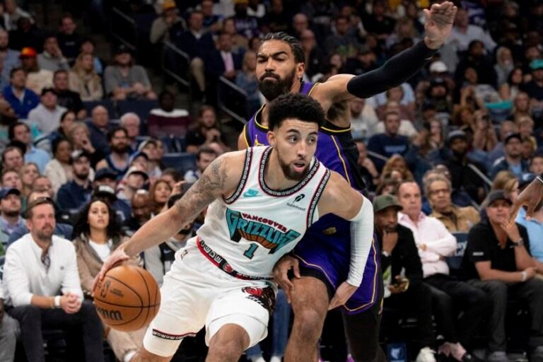 Memphis Grizzlies guard Scotty Pippen Jr. (1) drives past the defense of Los Angeles Lakers guard Gabe Vincent, right, in the first half of an NBA basketball game Wednesday, Nov. 6, 2024, in Memphis, Tenn. (AP Photo/Nikki Boertman)