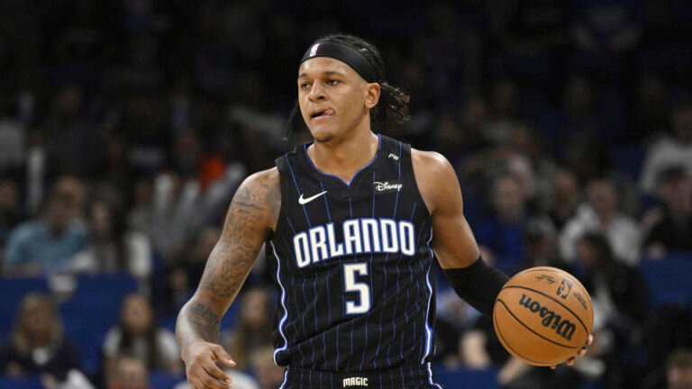 Orlando Magic forward Paolo Banchero (5) drives the ball against the Indiana Pacers during the first half of an NBA basketball game, Monday, Oct. 28, 2024, in Orlando, Florida (AP Photo/Phelan M. Ebenhack)